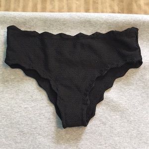 Cheeky black bathing suit bottoms